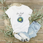 Close-up of the watercolour cabbage and 'Live Laugh Leaf' slogan on a t-shirt