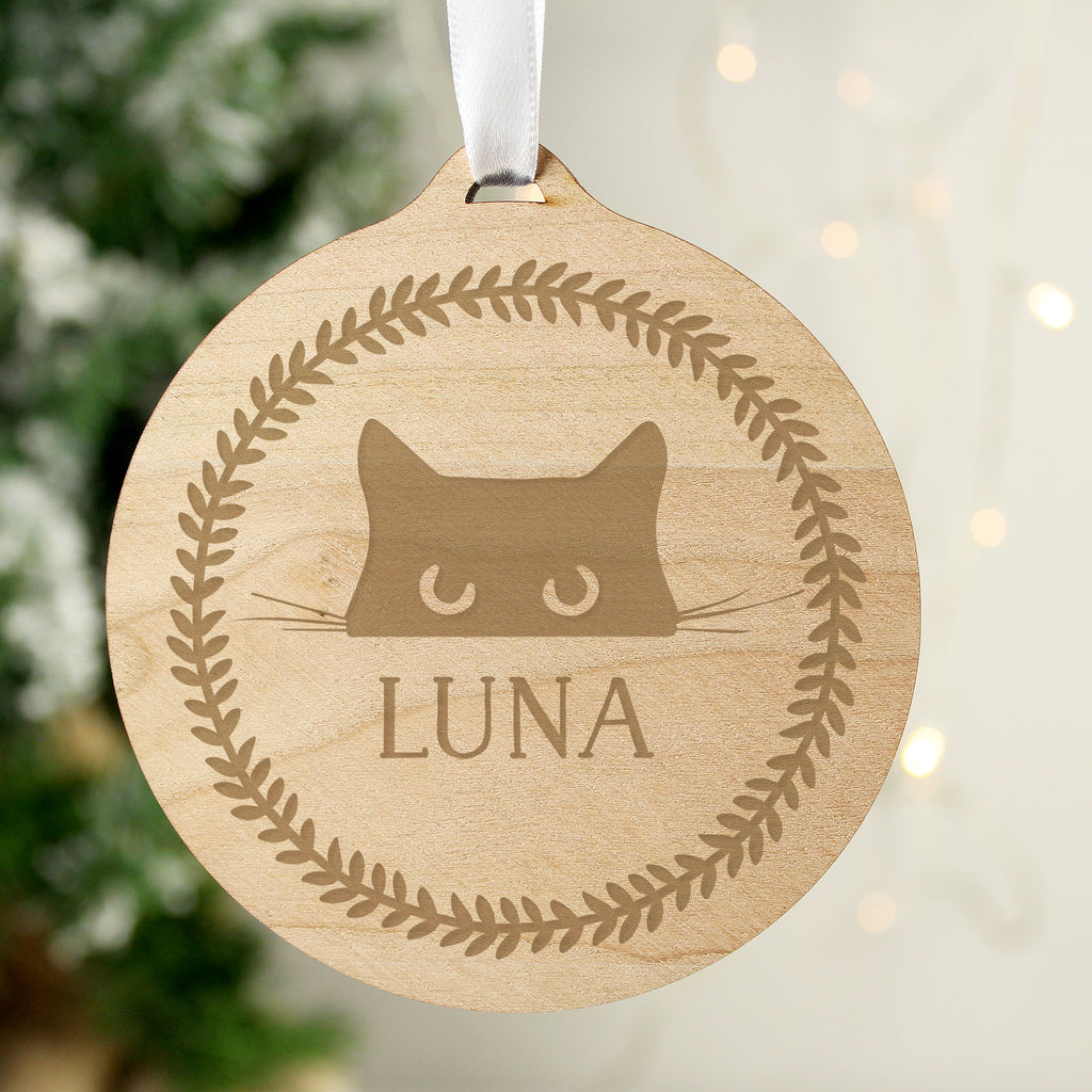 Personalised cat round wooden Christmas bauble hanging on the tree