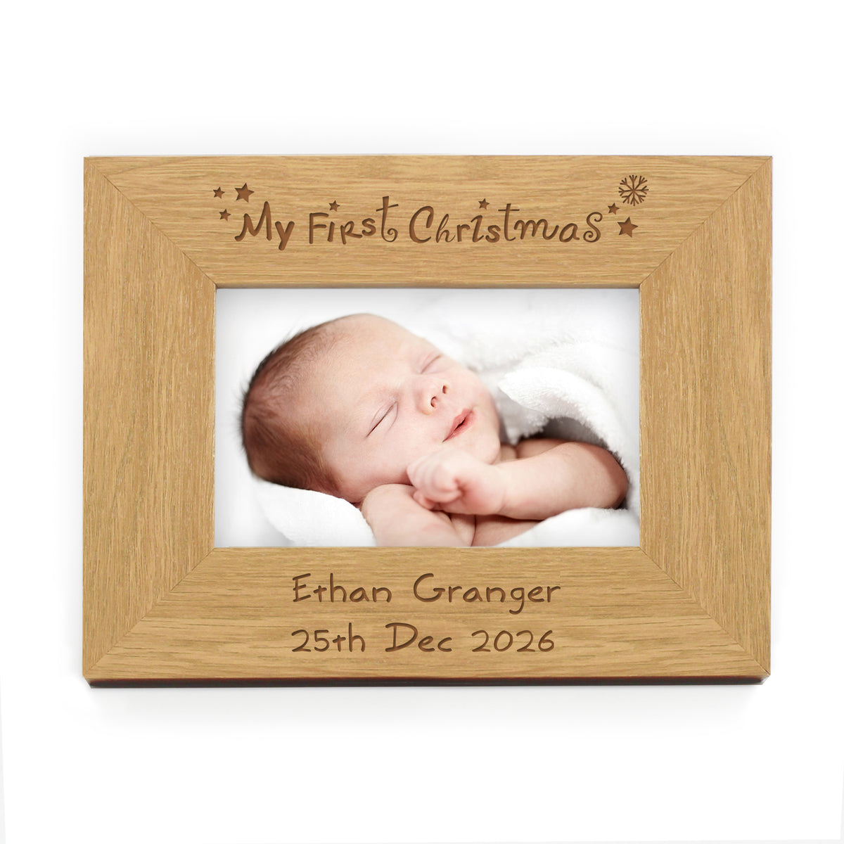 Personalised My First Christmas oak finish photo frame with a baby in a Santa outfit