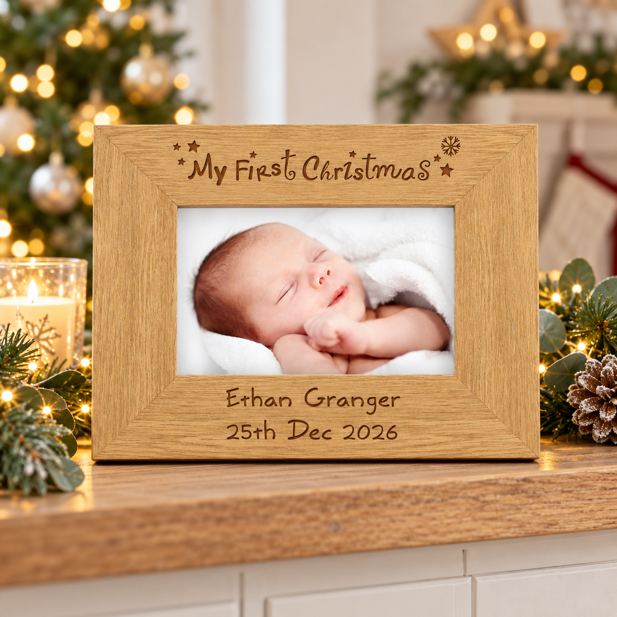 Personalised My First Christmas oak finish photo frame with a baby photo by the tree