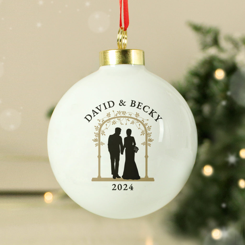 Personalised Mr & Mrs bride and groom ceramic bauble on a Christmas tree