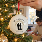 Personalised Mr & Mrs Bride and Groom Ceramic Bauble hanging on a Christmas tree