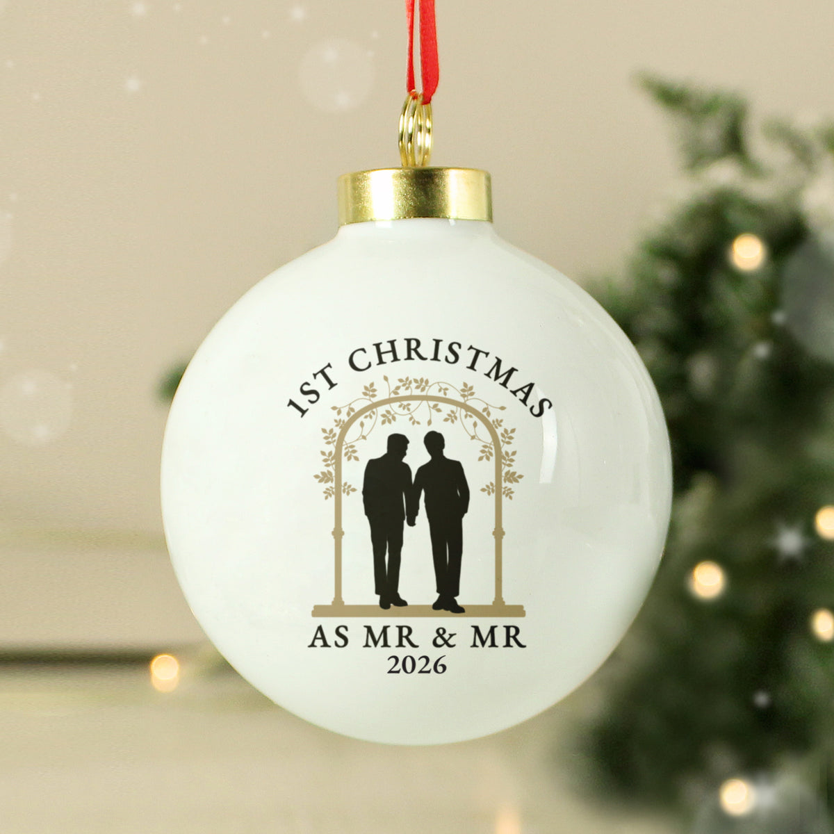 Personalised Mr & Mr ceramic Christmas bauble hanging on the tree