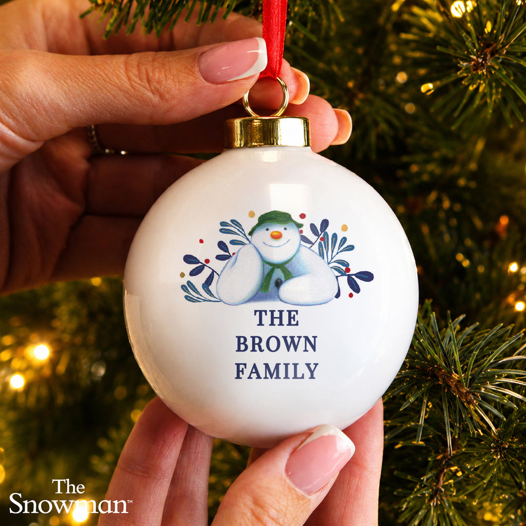 Personalised The Snowman Botanical Bauble hanging on a Christmas tree