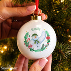 Personalised The Snowman Christmas Wishes Bauble hanging on a Christmas tree