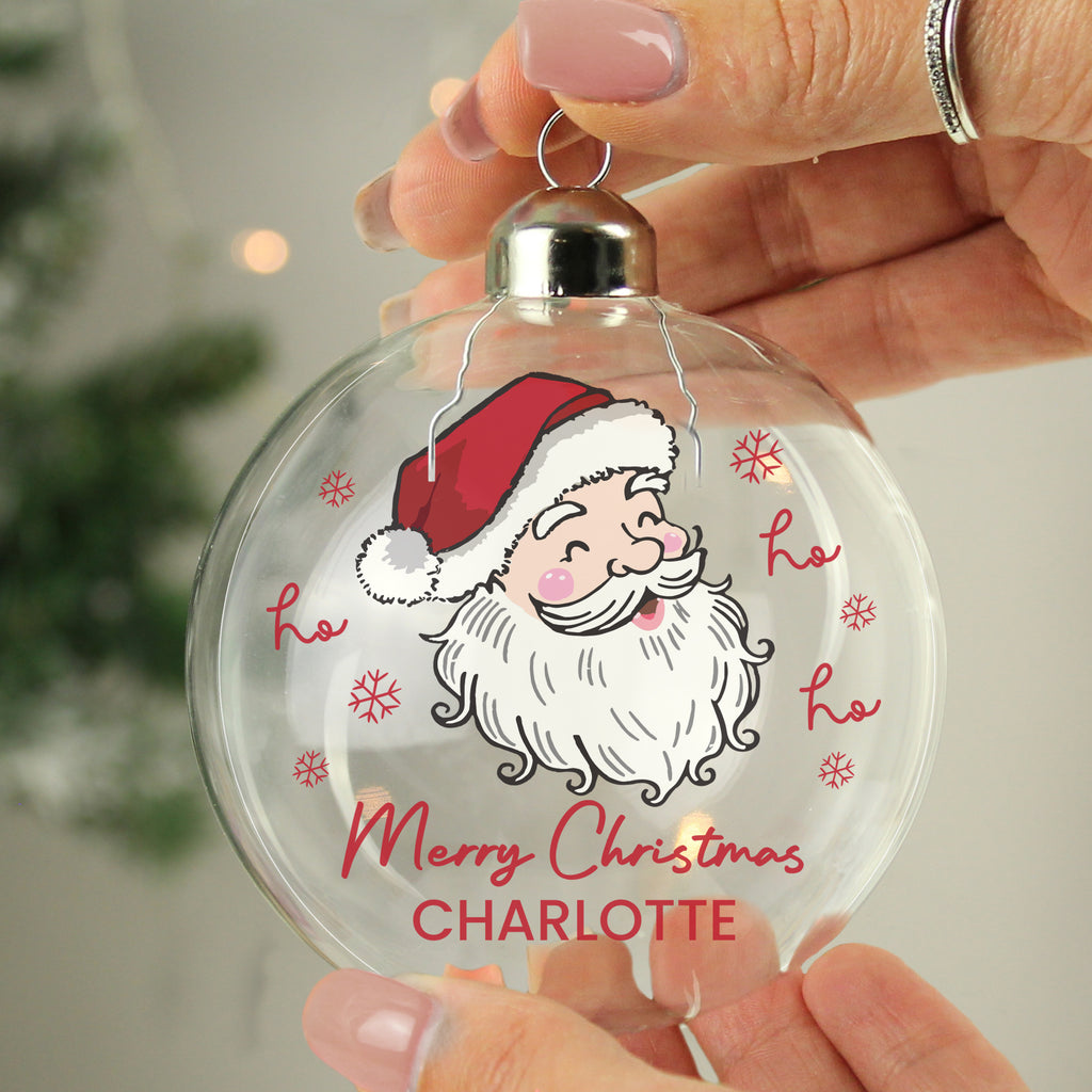 Personalised Santa Glass Bauble hanging on a Christmas tree