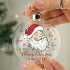 Personalised Santa Glass Bauble hanging on a Christmas tree