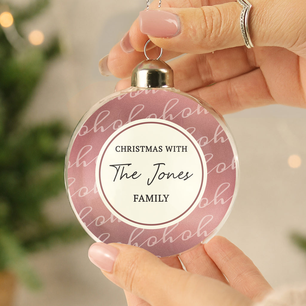 Personalised Ho Ho Ho Glass Bauble hanging on a Christmas tree