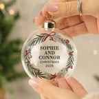 Personalised Green Christmas Wreath Glass Bauble hanging on a Christmas tree