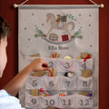 Personalised Rocking Horse Silver Grey Advent Calendar hanging on the wall at Christmas