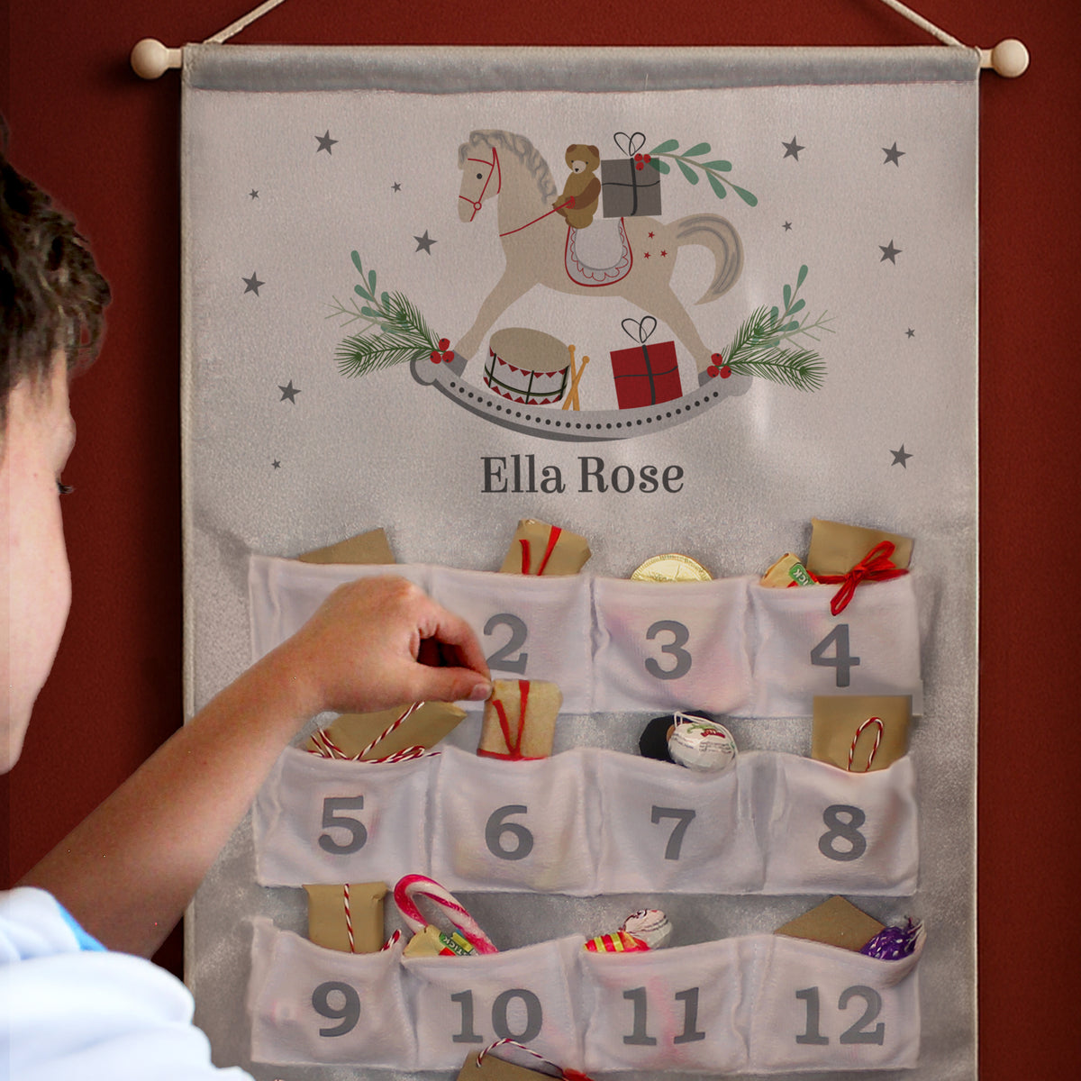 Personalised Rocking Horse Silver Grey Advent Calendar hanging on the wall at Christmas
