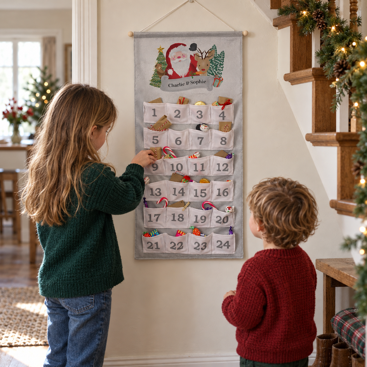 Two children opening the Personalised Santa Advent Calendar in the hallway