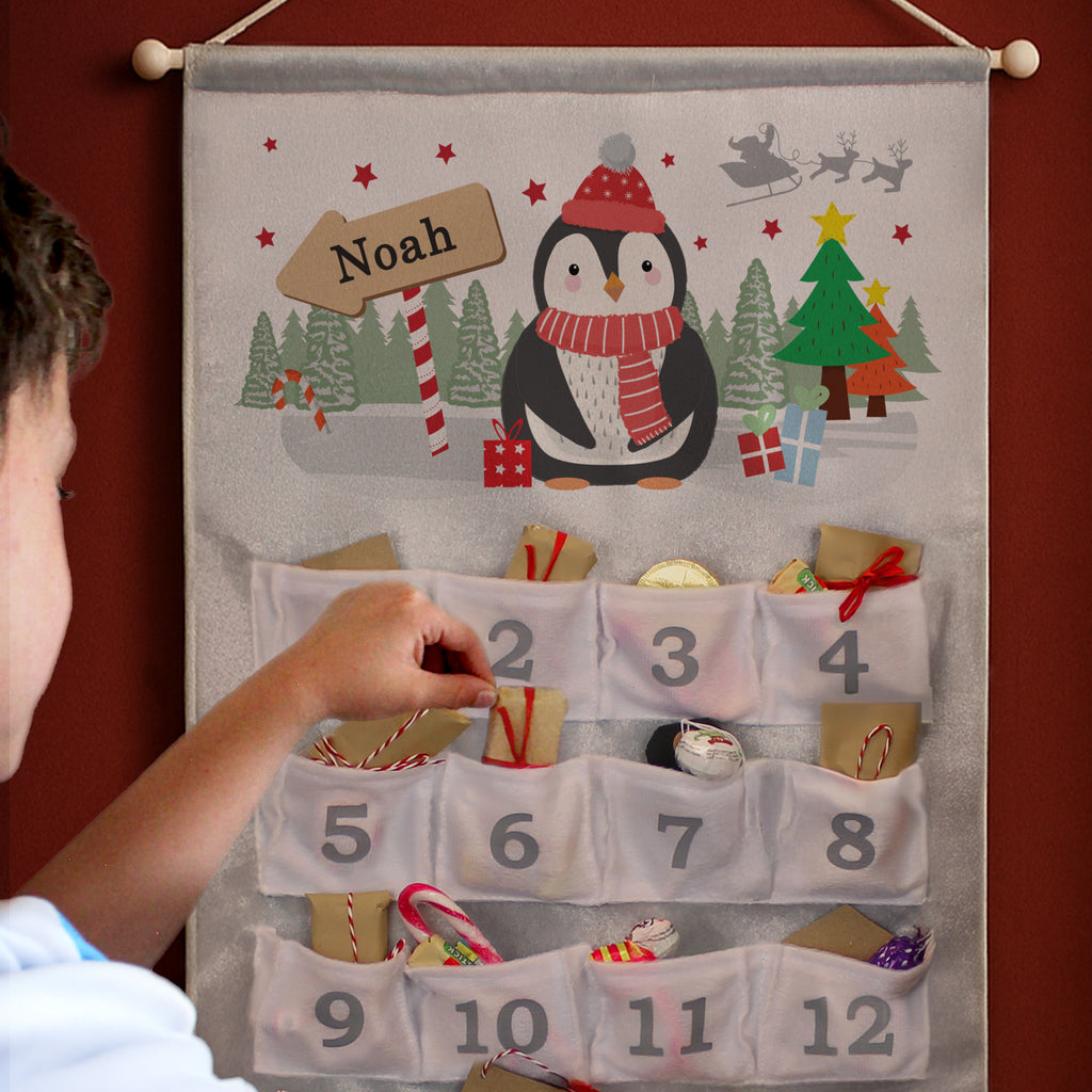 Personalised Christmas Penguin Silver Grey Advent Calendar hanging on the wall at Christmas