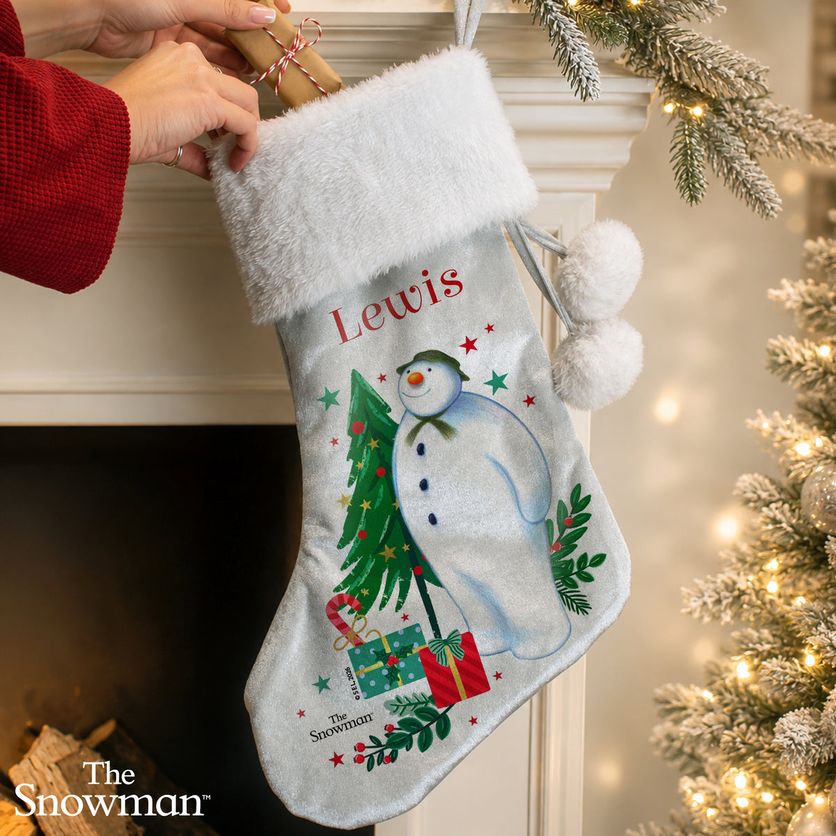 Personalised The Snowman Christmas Wishes Stocking hanging by the fireplace
