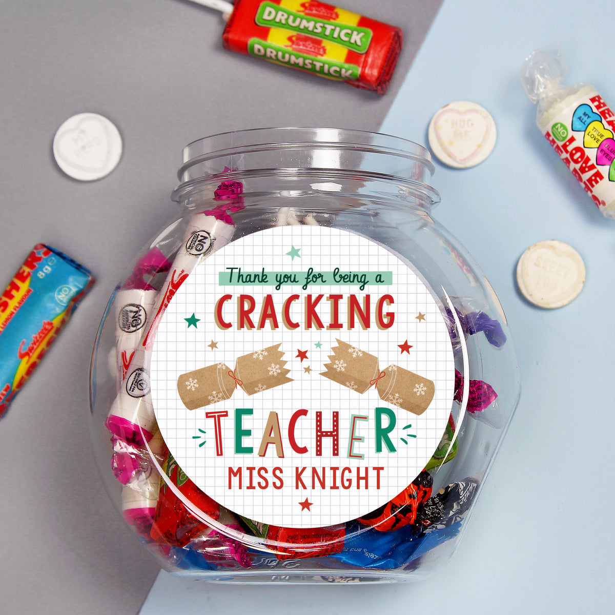 Personalised Cracking Teacher Christmas sweet jar on a classroom desk