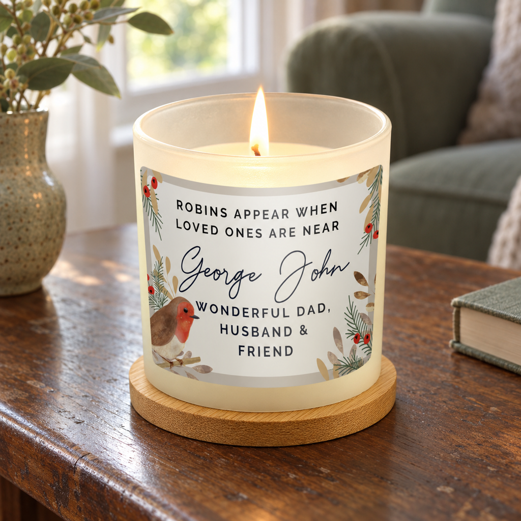 Personalised Robins Appear memorial candle jar lit on a wooden table