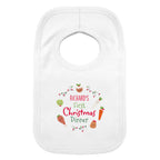 Baby wearing a personalised First Christmas Dinner bib