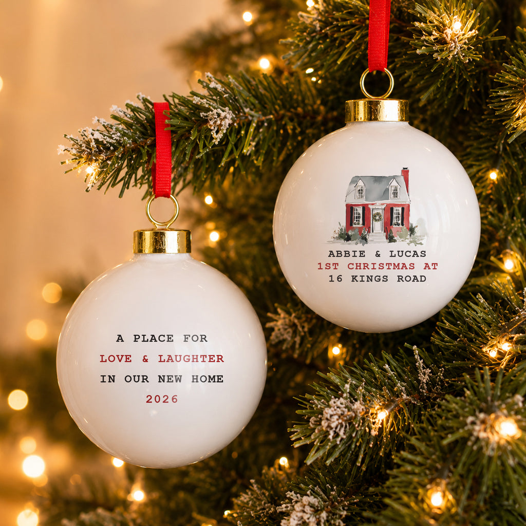 Personalised Watercolour House Ceramic Bauble hanging on a Christmas tree