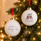 Personalised Watercolour House Ceramic Bauble hanging on a Christmas tree