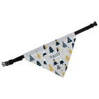 Dog wearing a personalised grey Christmas tree bandana with its name