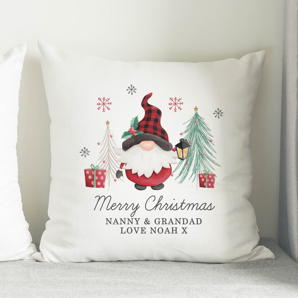 Personalised Gonk Merry Christmas Cushion on a sofa
