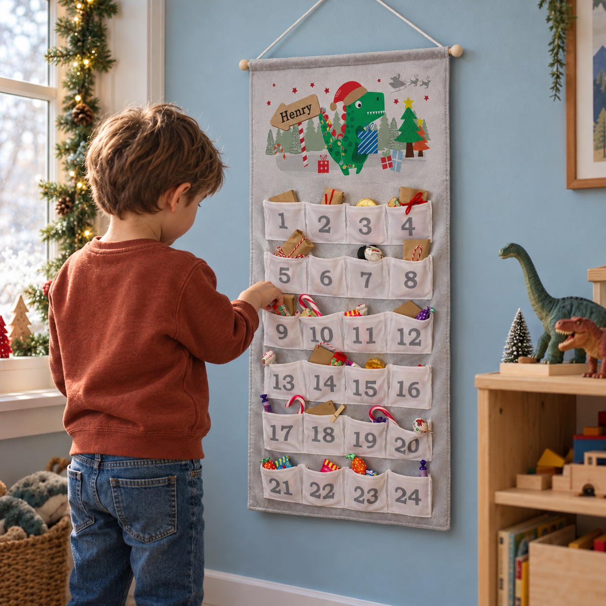 Boy opening the Personalised Dinosaur Advent Calendar in his bedroom