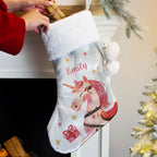 Personalised Unicorn Christmas Stocking hanging by the fireplace