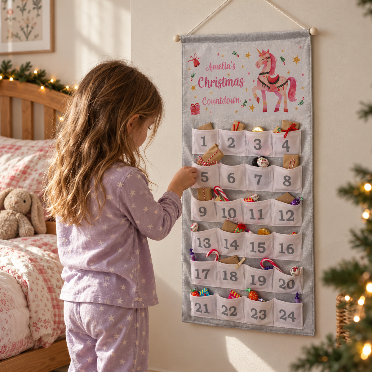 Girl opening a pocket on the Personalised Unicorn Christmas Advent Calendar in her bedroom