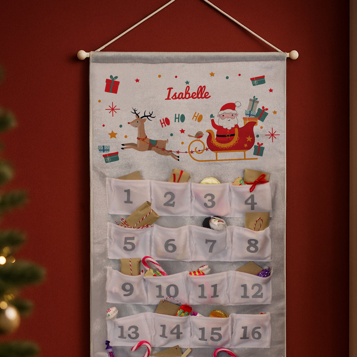 Personalised Santa Sleigh Advent Calendar hanging on the wall at Christmas