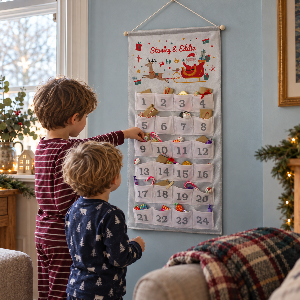 Two brothers opening the Personalised Santa Sleigh Advent Calendar in pyjamas