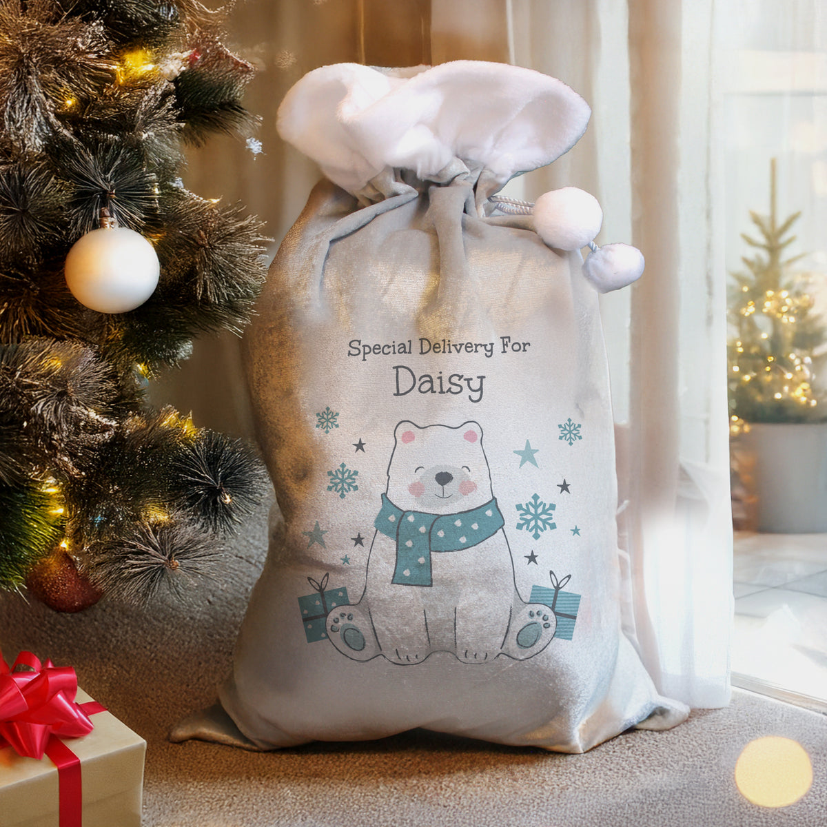 Personalised Polar Bear Special Delivery Christmas Sack beside the Christmas tree