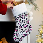 Personalised Leopard Print Christmas Stocking hanging by the fireplace