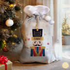 Personalised Nutcracker Christmas Sack beside the Christmas tree