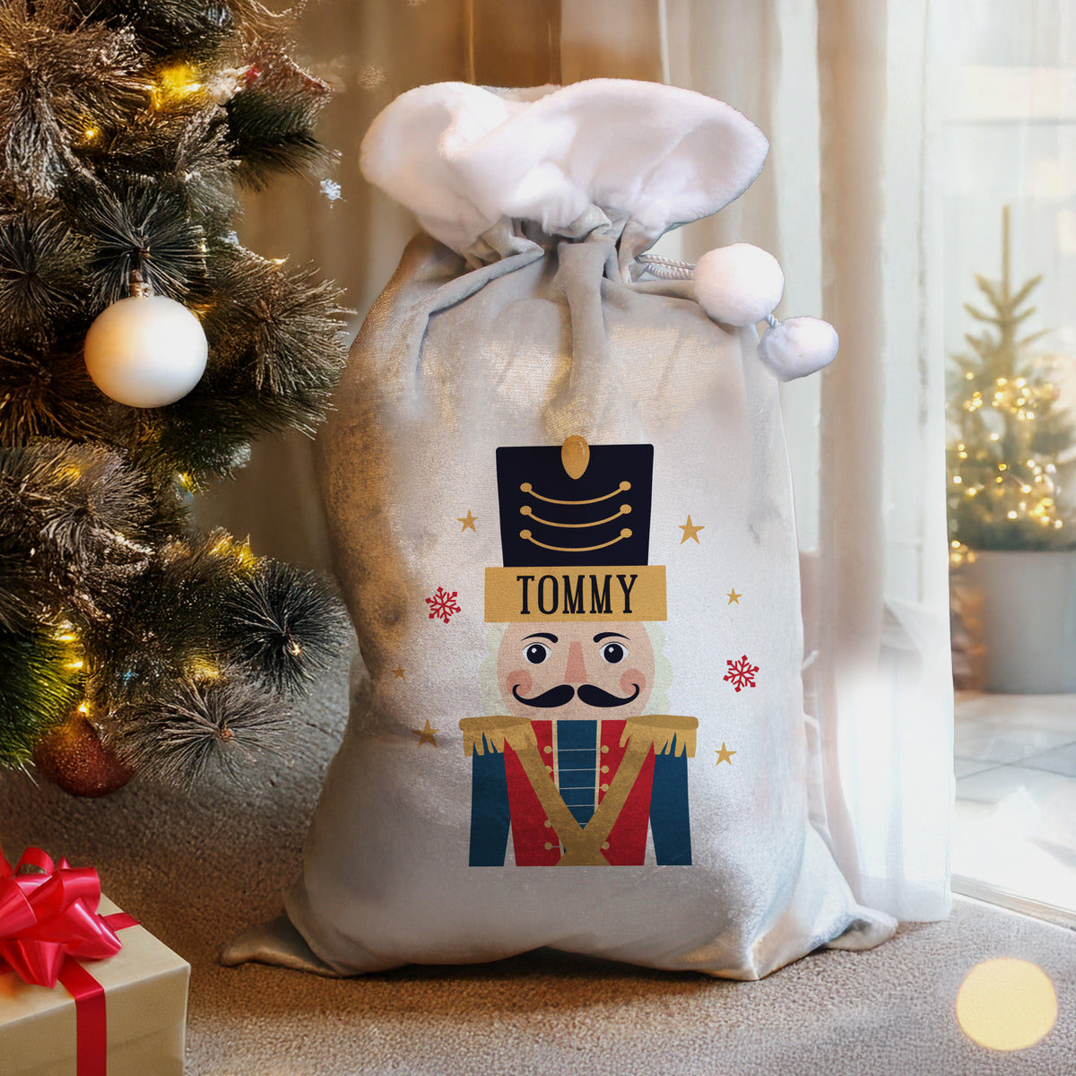 Personalised Nutcracker Christmas Sack beside the Christmas tree