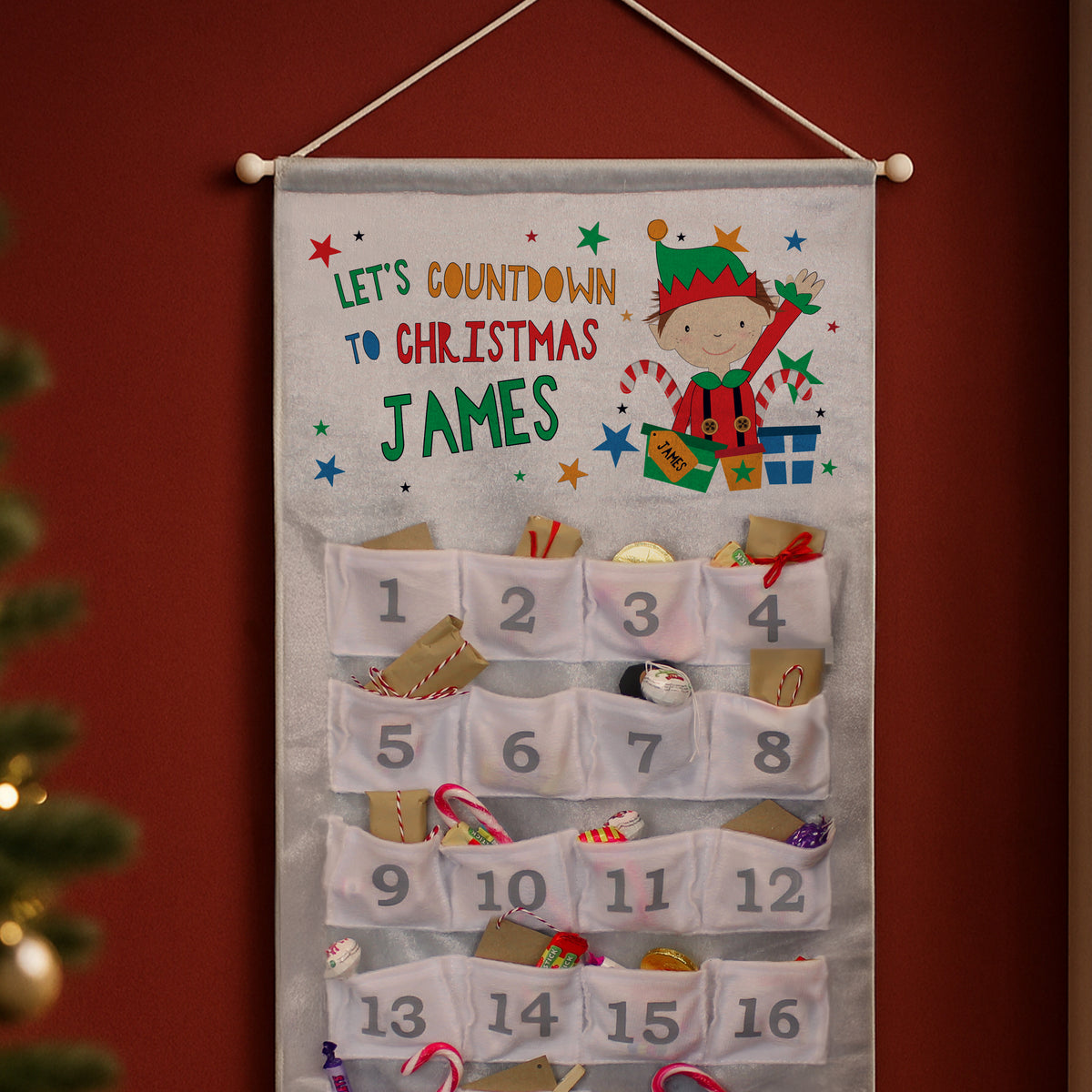 Personalised Christmas Elf Advent Calendar hanging on the wall at Christmas