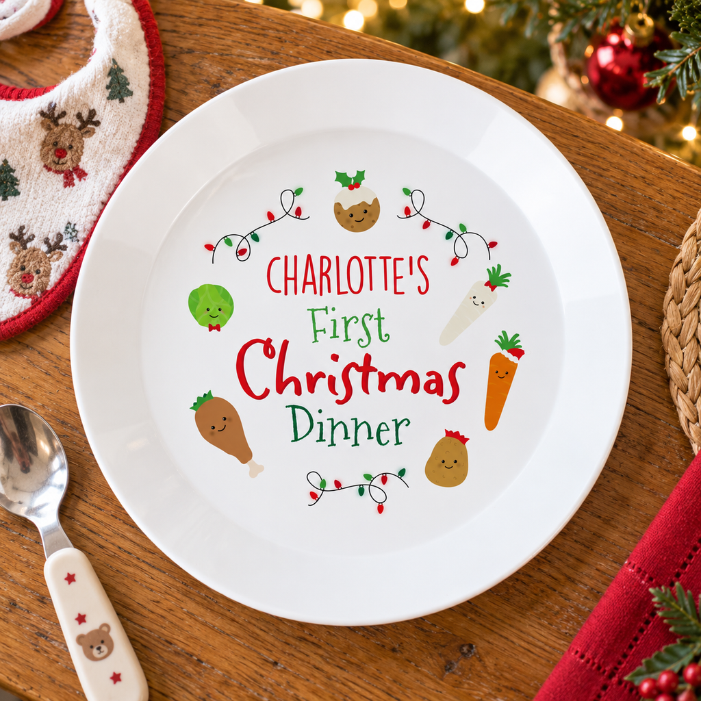 Personalised First Christmas Dinner plate on a festive table with a baby spoon