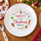 Personalised First Christmas Dinner plate on a festive table with a baby spoon