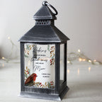 Personalised Robins Appear memorial black lantern glowing beside a Christmas tree