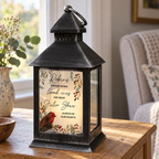 Personalised Robins Appear memorial black lantern glowing on a side table