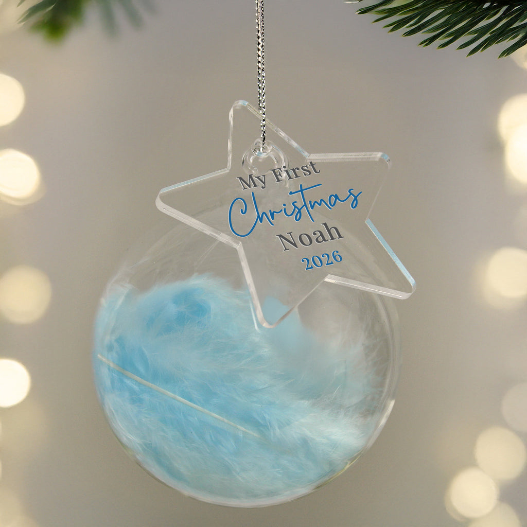 Personalised My First Christmas blue feather glass bauble hanging on the tree