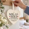 Personalised Mr & Mrs Wooden Heart Decoration hanging on a peg rail