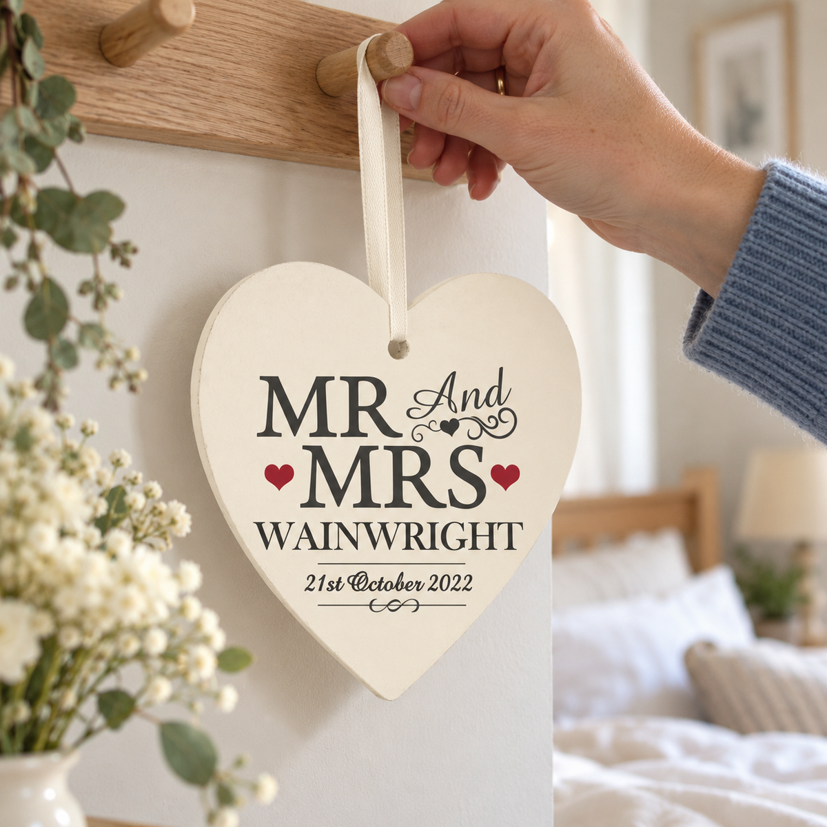 Personalised Mr & Mrs Wooden Heart Decoration hanging on a peg rail