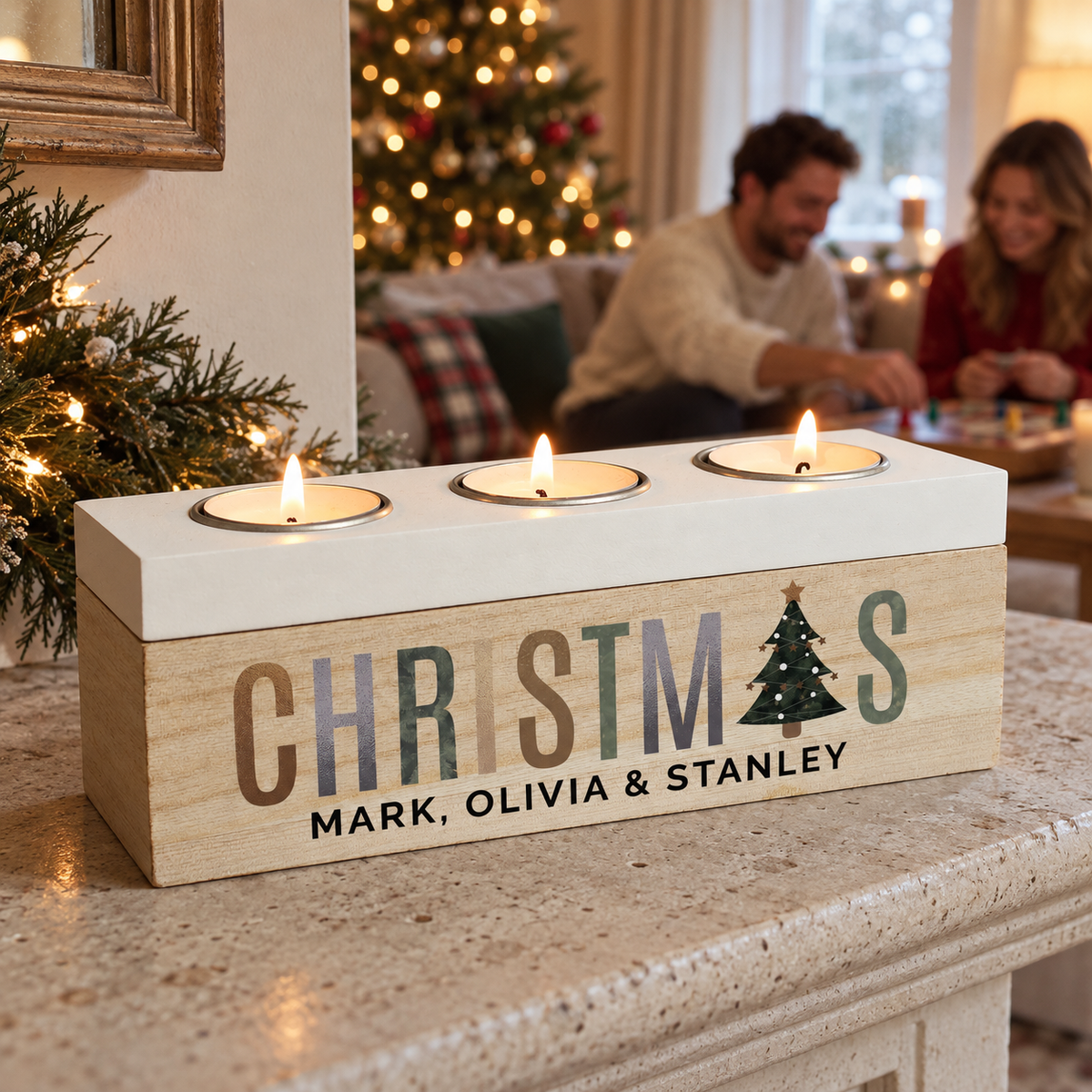 Personalised Christmas Tree Triple Tea Light Box with three lit candles in the living room