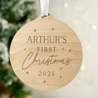 Personalised Baby's First Christmas round wooden decoration hanging on the tree