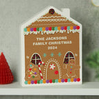 Personalised Gingerbread House Wooden Christmas Ornament standing on a shelf