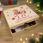 Personalised pink unicorn wooden Christmas Eve box under the Christmas tree