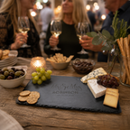 Personalised Mr and Mrs slate cheeseboard with elegant engraved lettering and natural rustic edges.