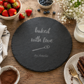 Personalised round slate cake plate engraved with a “Baked with Love” design and name.