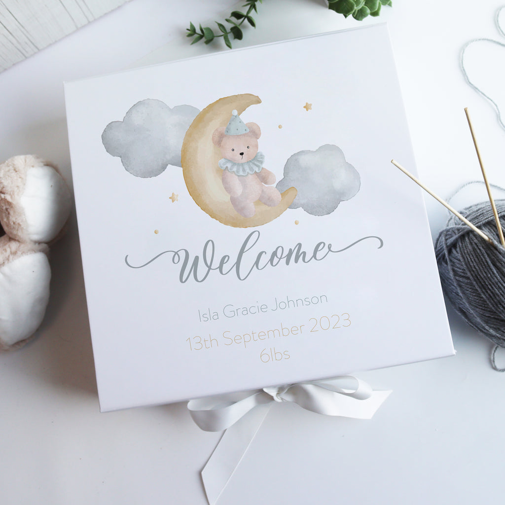 White personalised baby gift box with watercolour illustration and magnetic closure, a luxury new baby gift for parents and families