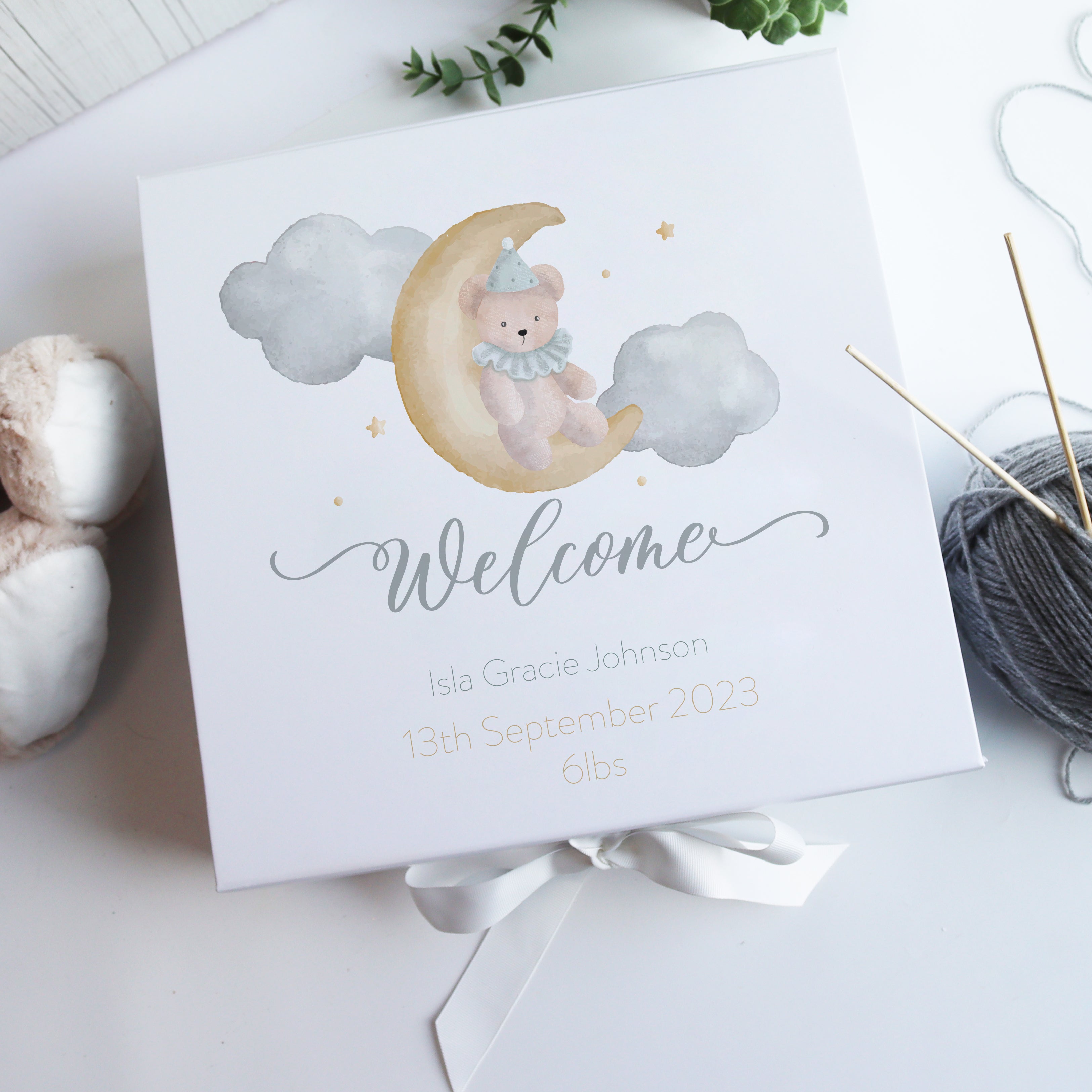White personalised baby gift box with watercolour illustration and magnetic closure, a luxury new baby gift for parents and families